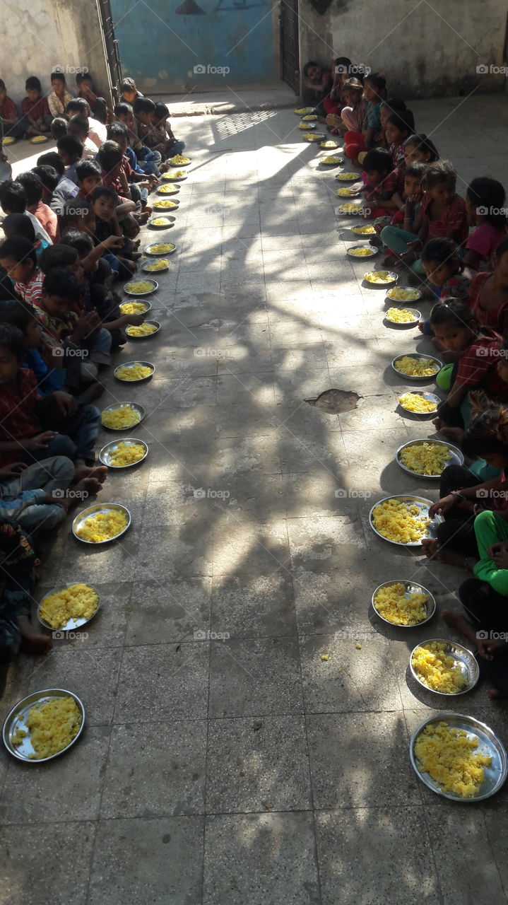 Group of children eating food