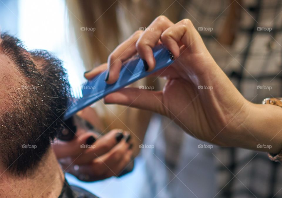 Young man at the barber