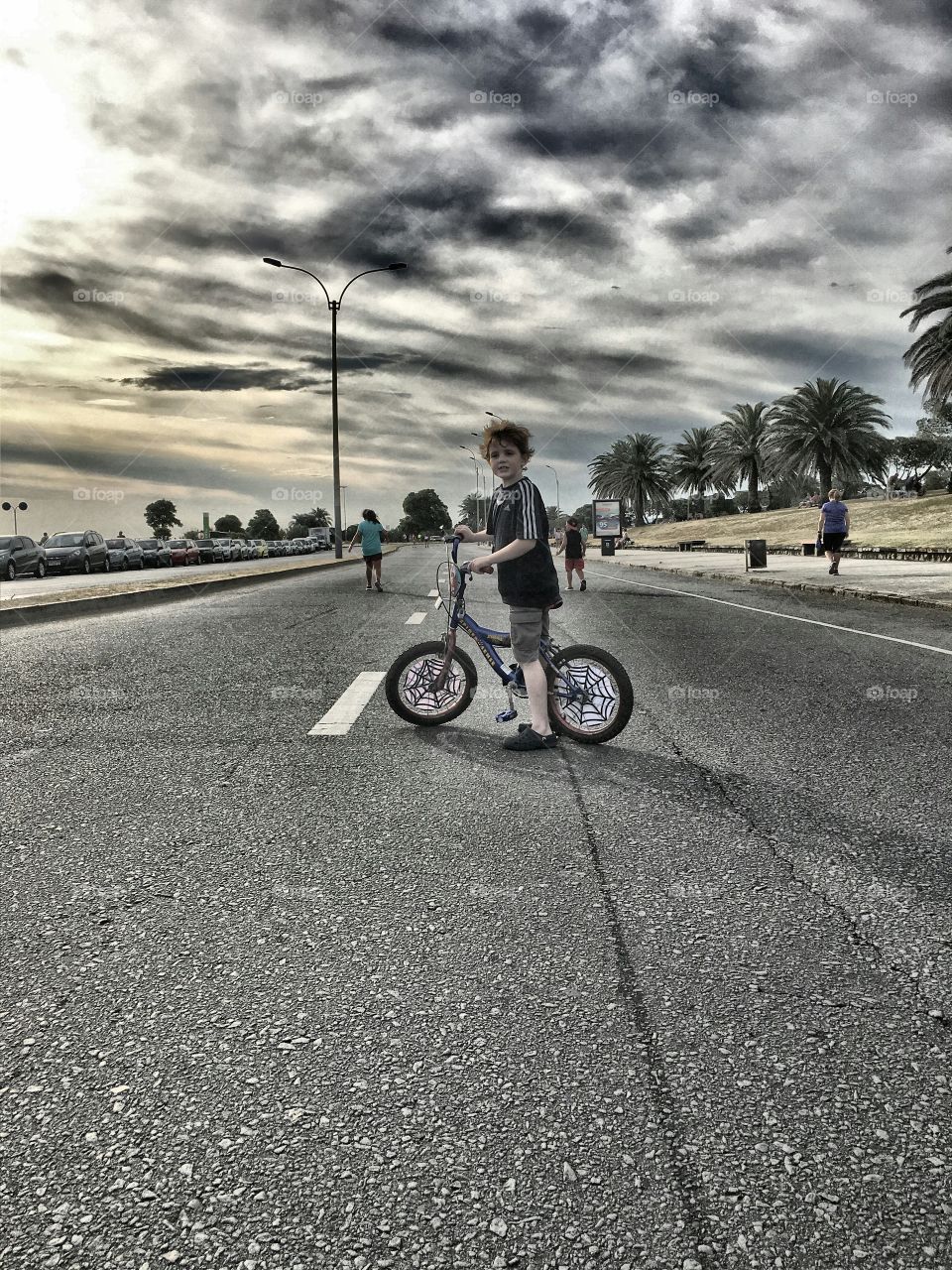 Little boy riding on bicycle