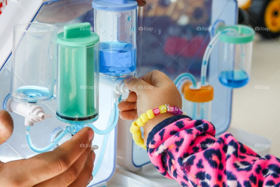 Child entertained by a science experiments