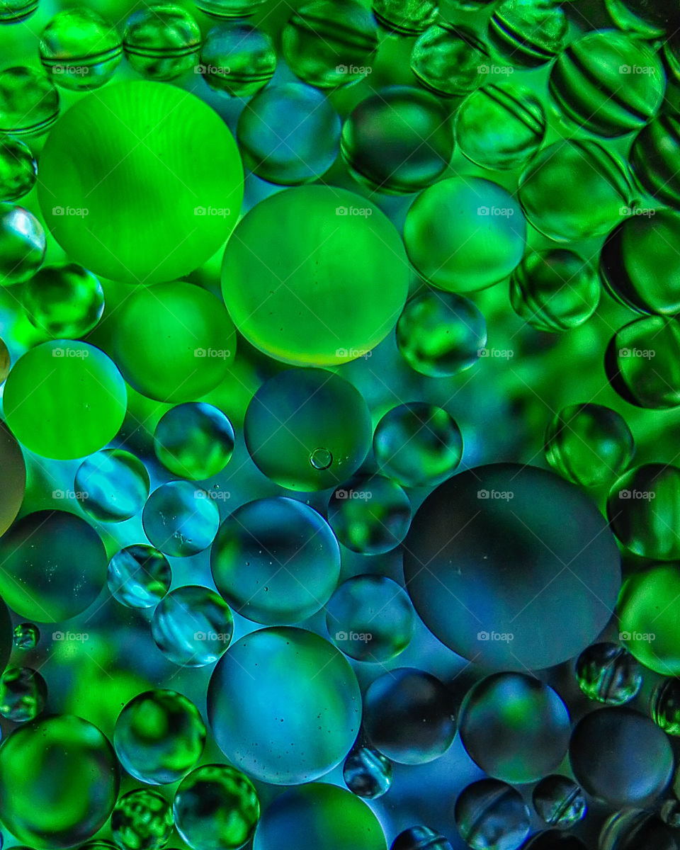 green bubbles oil in the water