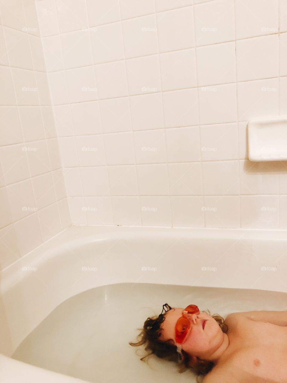 Child Taking a Bath With Goggles 