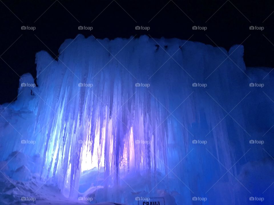Cold frozen glowing icicles in the ice castle.