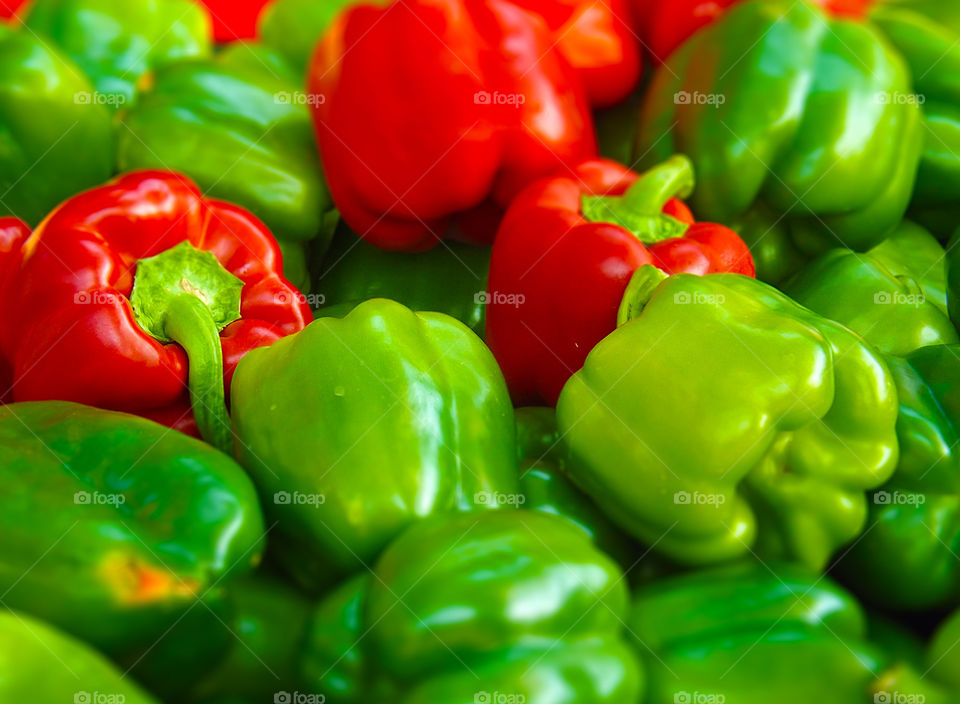 Vibrant Green and Red Bell Peppers. I photographed these bell peppers at the Farmers Market in Kansas City and added vibrance and a tilt shift effect.