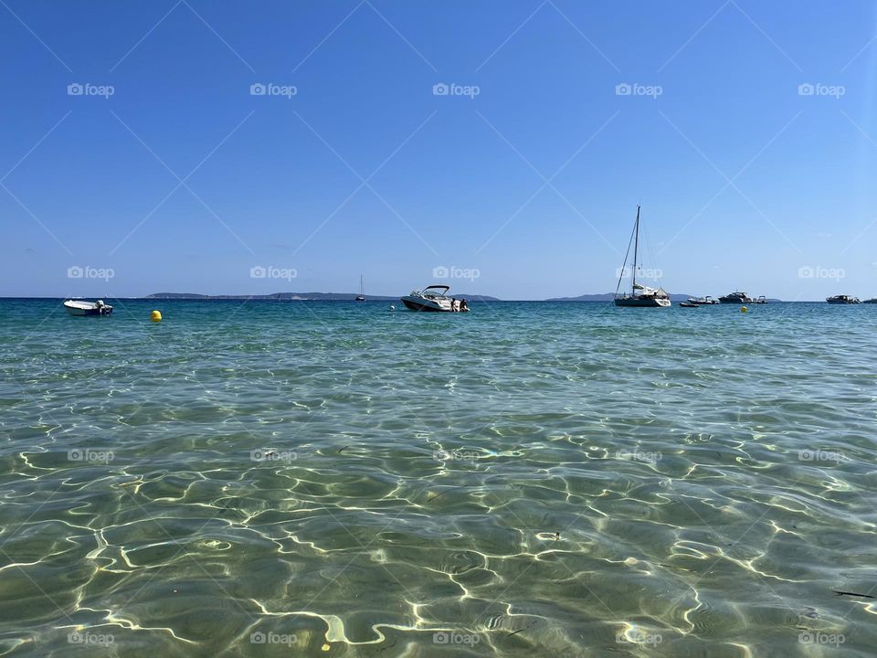 Boats in transparent water