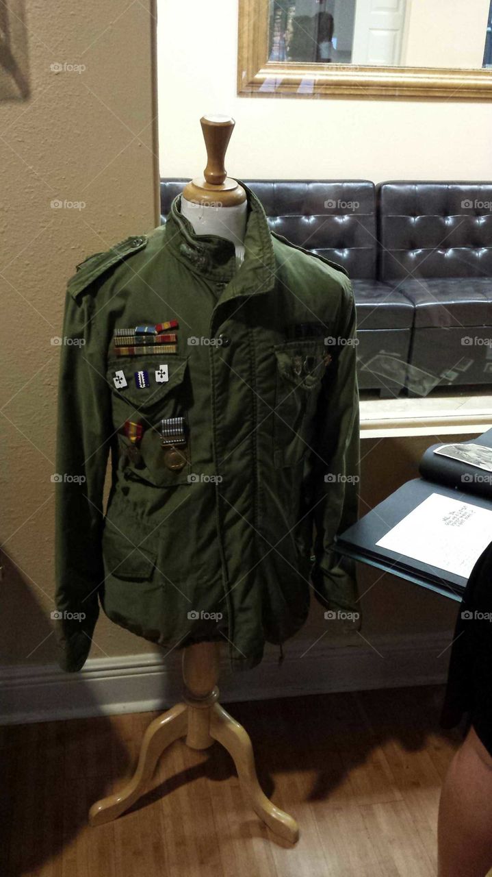 Old Military Uniform on Mannequin Showing Rankings and Medals