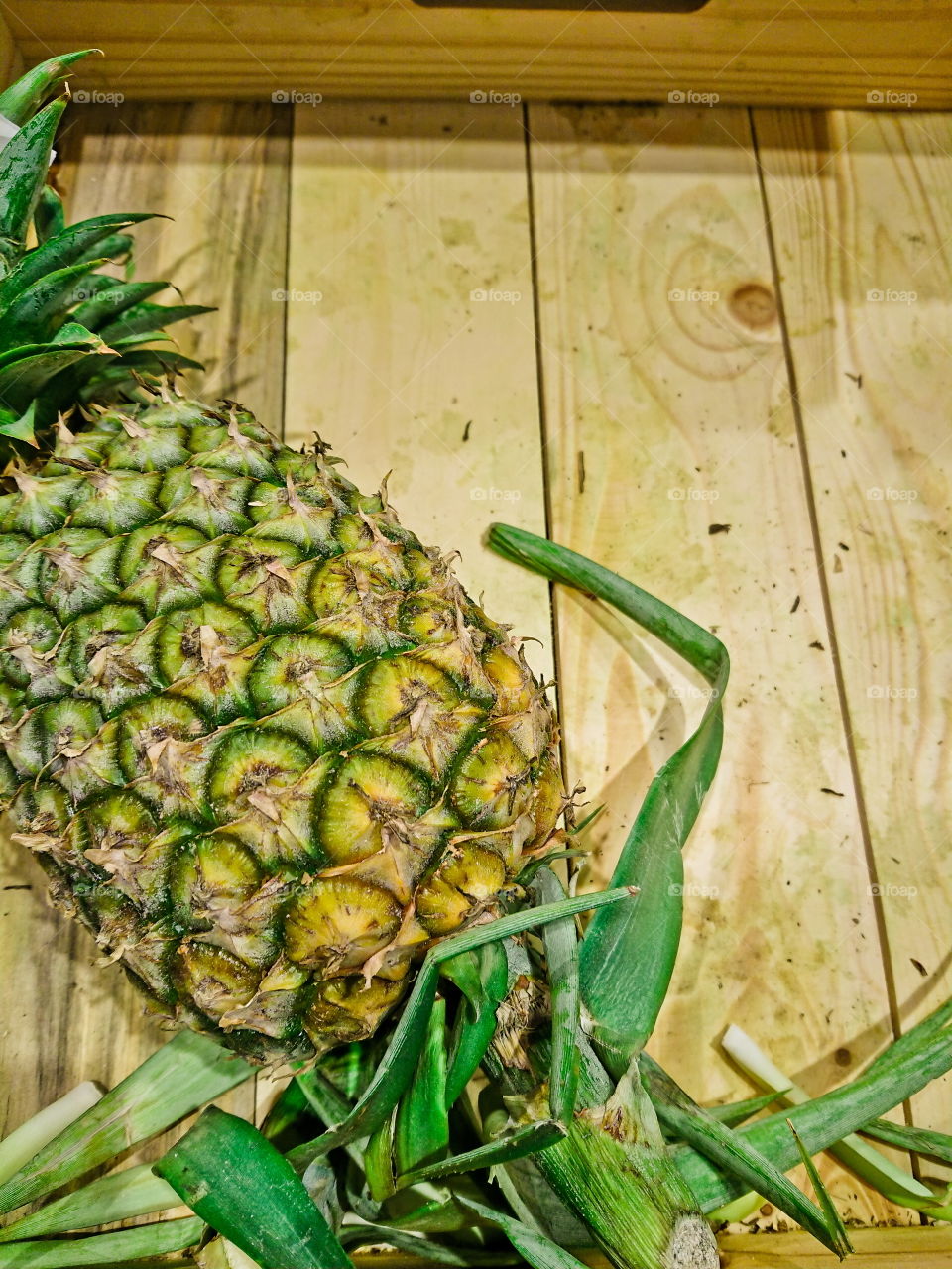 Pineapples in​ box.