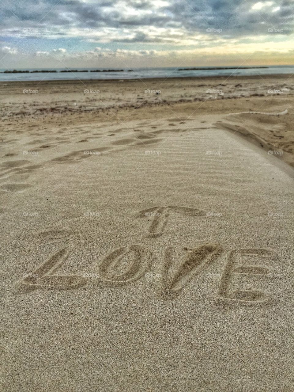 Love letters on the sand