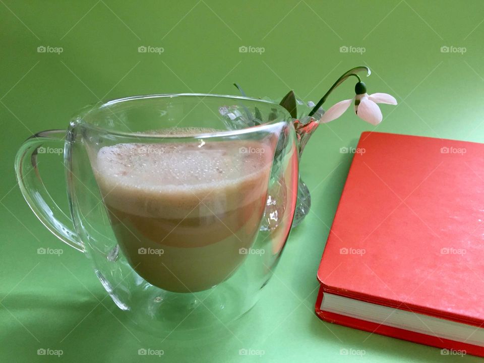Flower in vase and cup with coffee