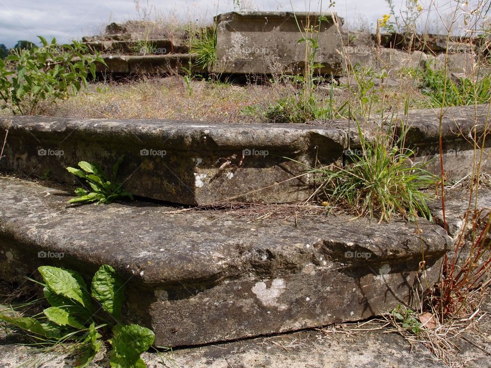 The remains of steps to an old castle on the grounds of Castle Howard in the English countryside. 