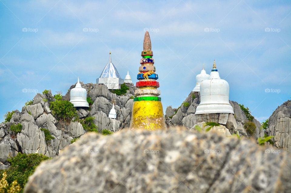 Close-up view of mini-stupa on top of rocky mountains in Lampang, Thailand 