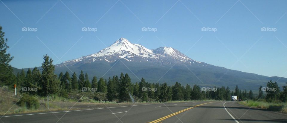 stunning view of Mount Shasta captured during a road trip through California on a clear sunny day