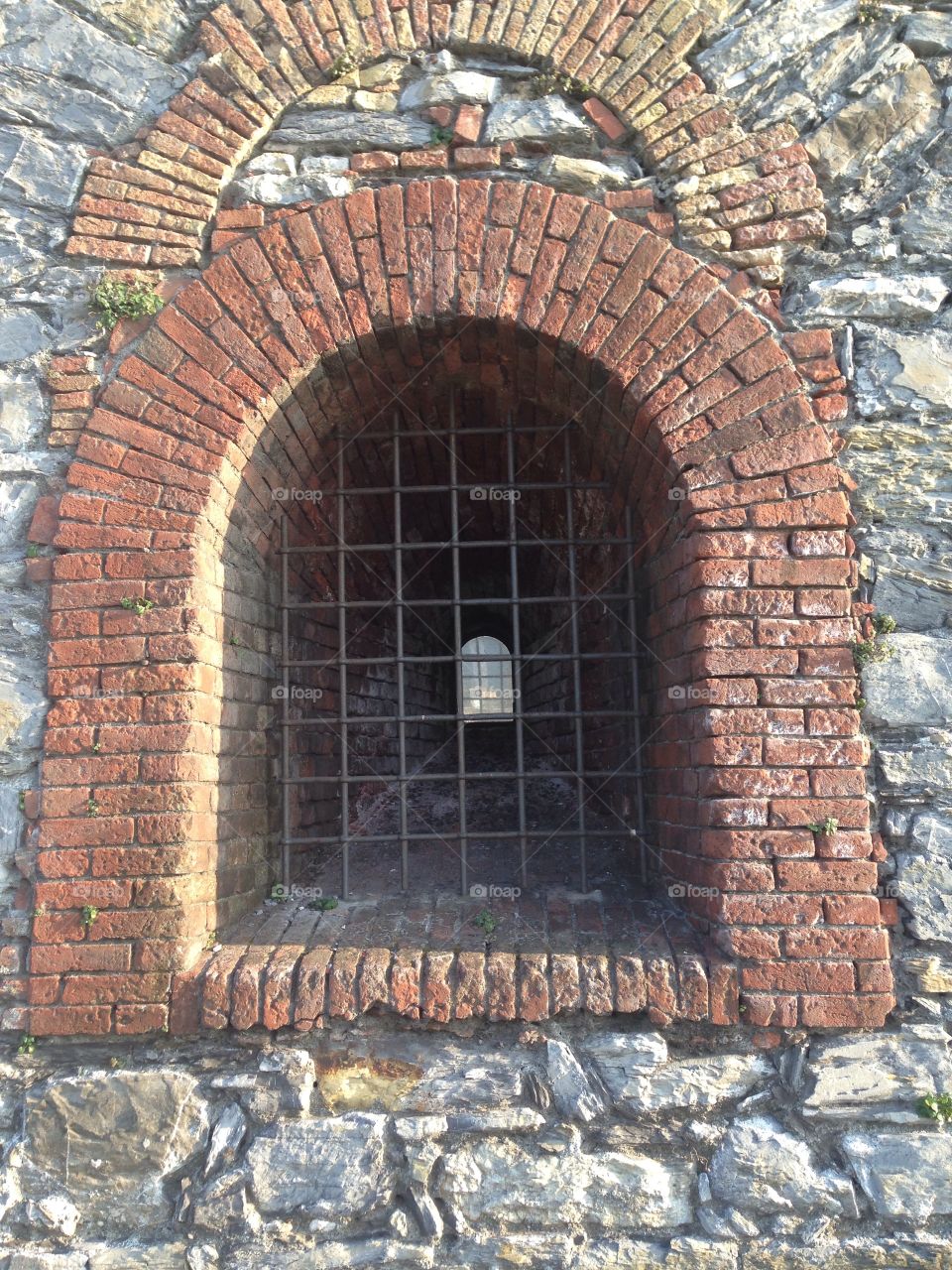 Arch window on stone wall