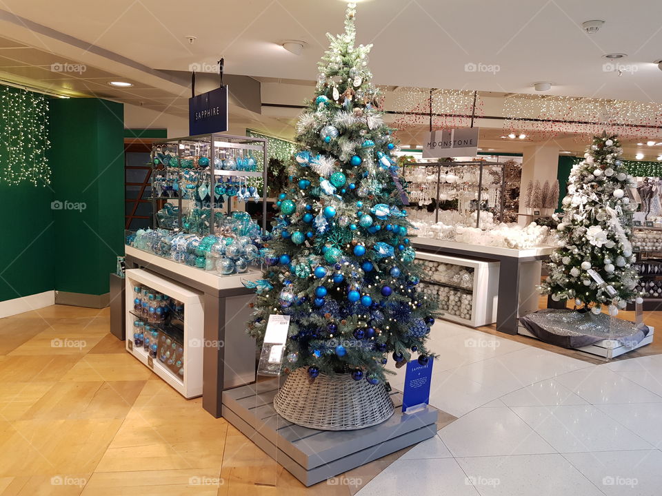 Christmas shop decorations tree with baubles at Peter Jones Sloane square Chelsea King's road London