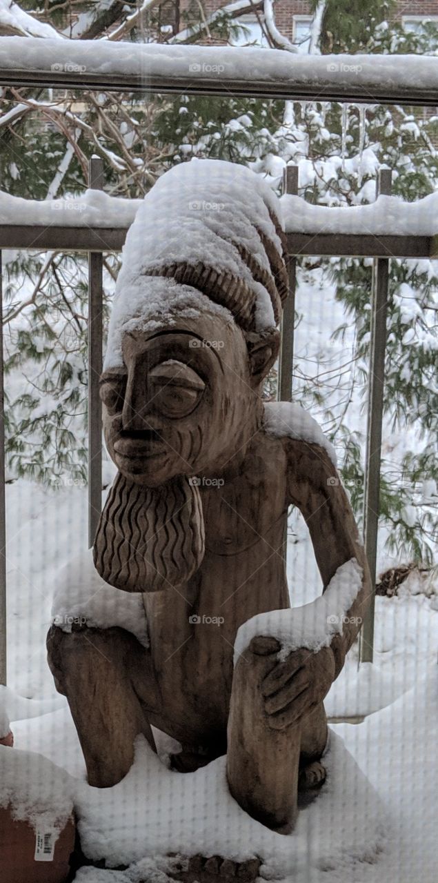 Yoruba statue in snow