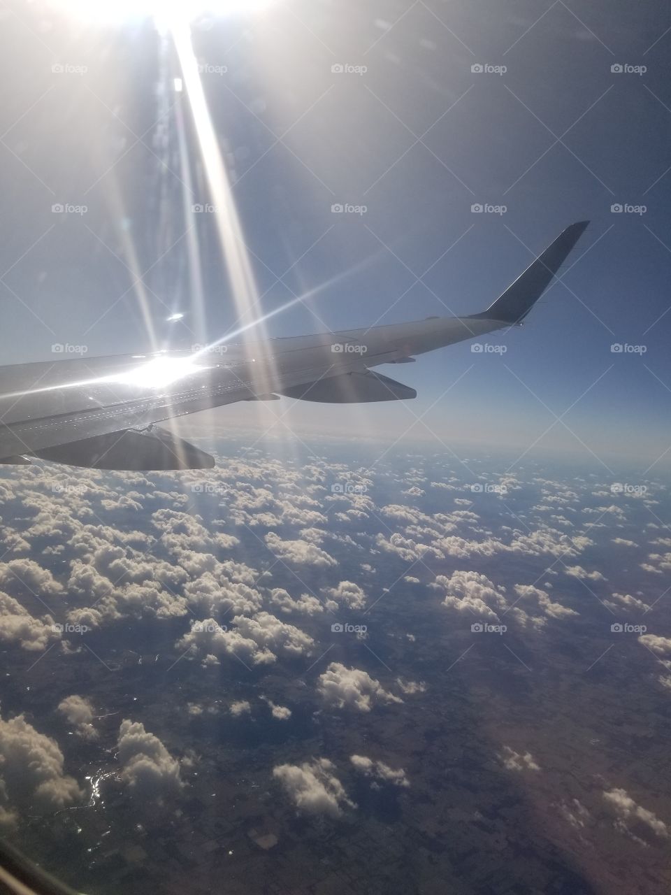 Blinding Flash Against Fluffy Cloud Islands