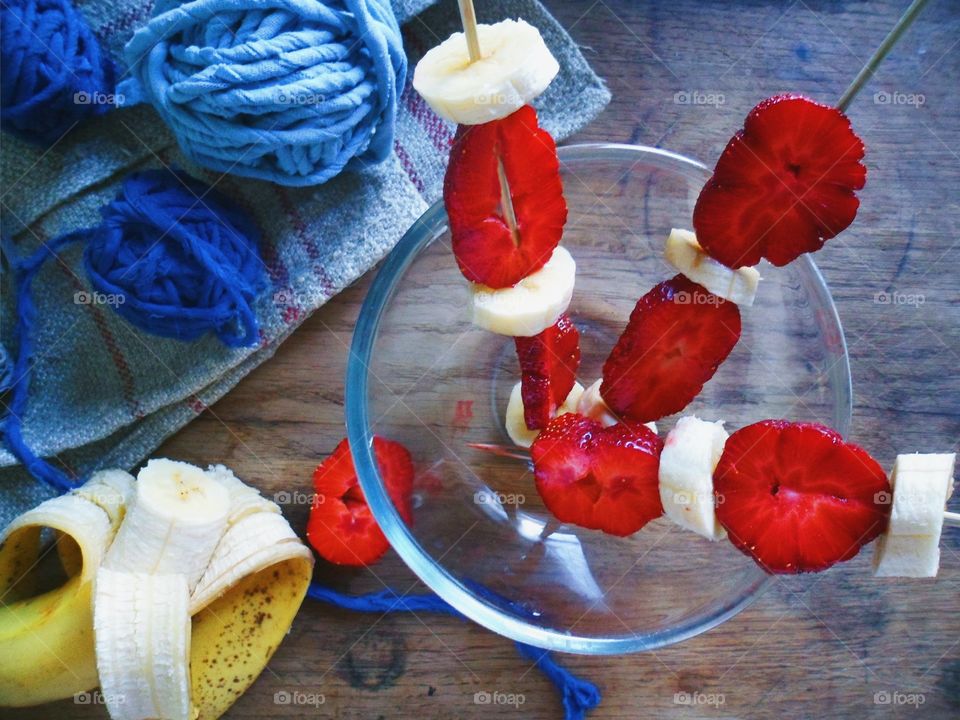 strawberry and banana on a wooden skewer