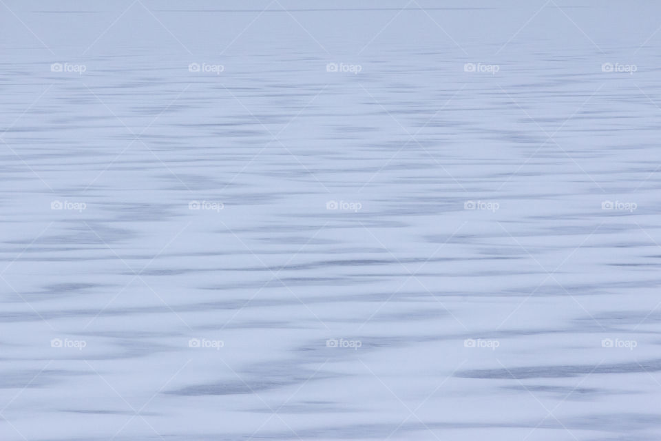 Snow pattern on ice - frozen lake - frusen sjö is snö mönster vågor