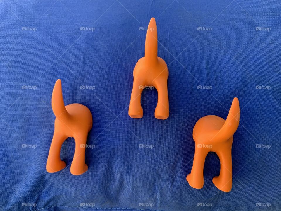 Orange clothes hangers like dog tide 