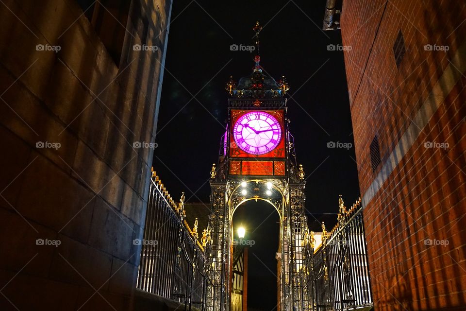 Chester Clock lit up at night 