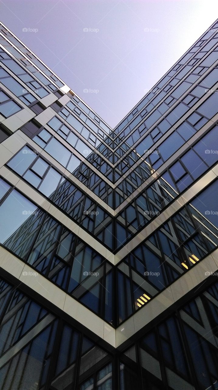 Reflections in windows of modern office building