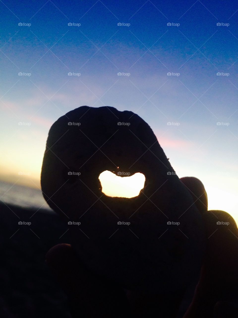 Love rock. A lucky stone with a heart found at sunset in Maui