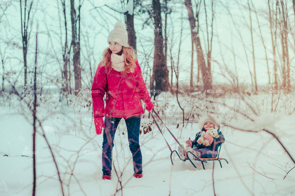 Winter with friends. Spending wintertime outdoors playing with snow