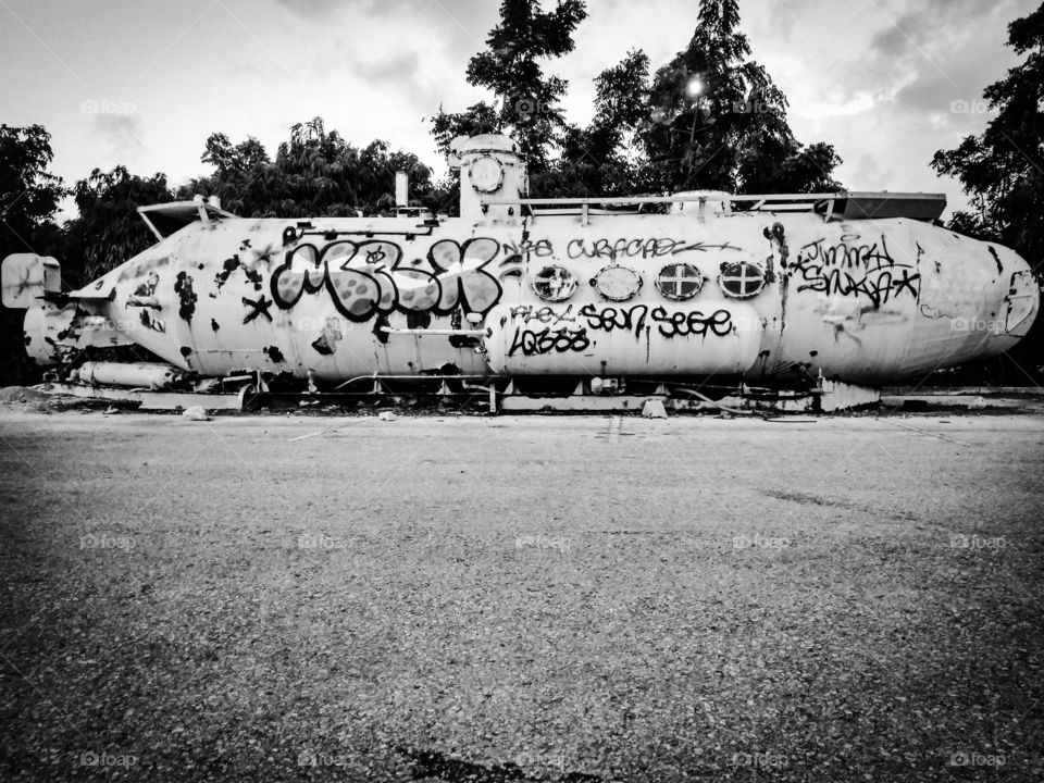 b&w submarine with graffiti all over