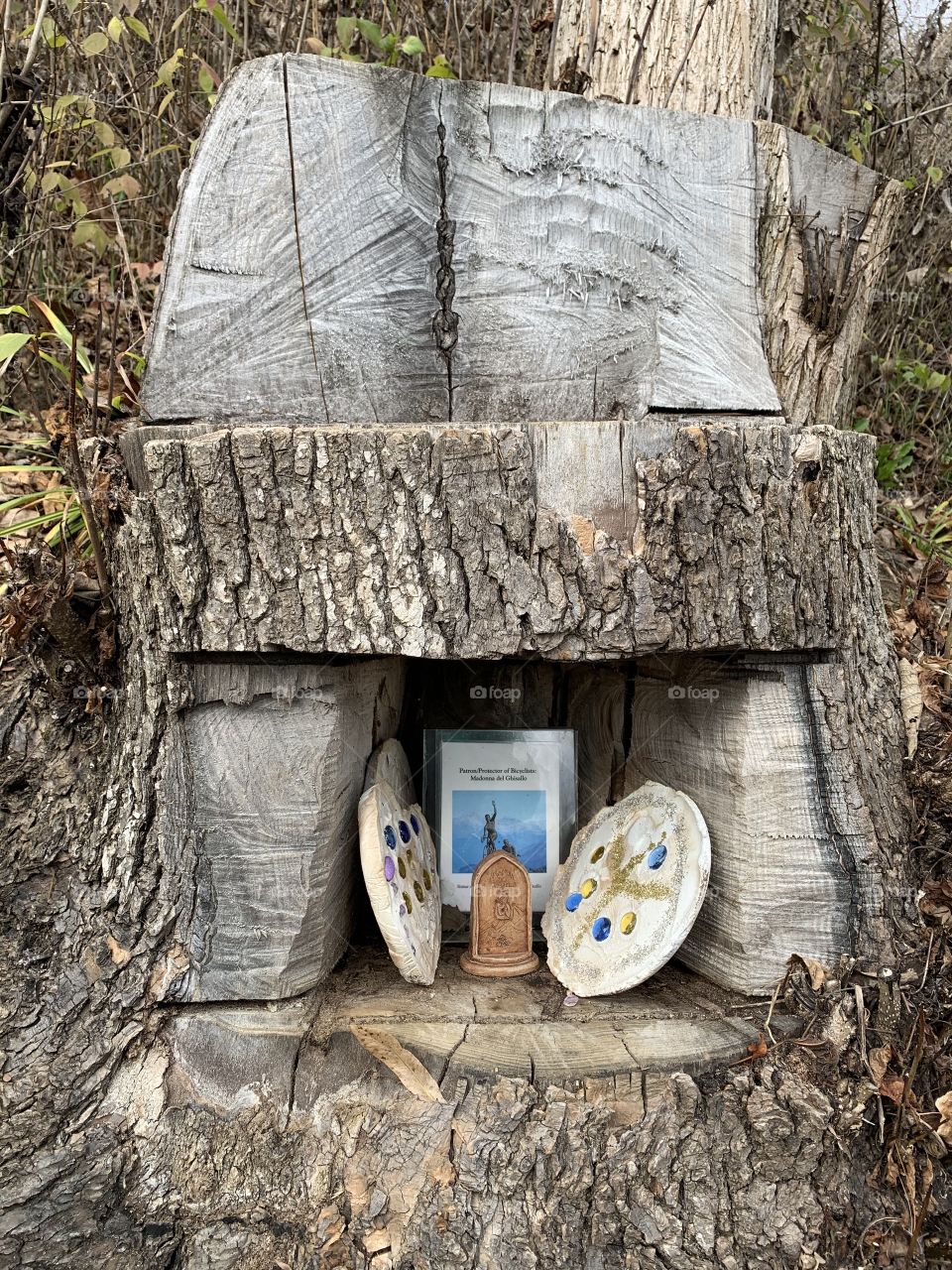 A prayer for local bicyclists, left inside of a tree stump which was carved into a chair. 