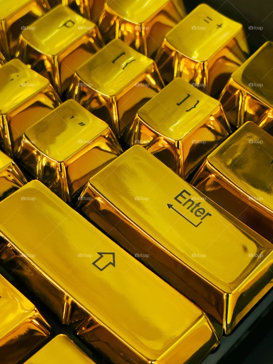 Computer keys on a golden keyboard 