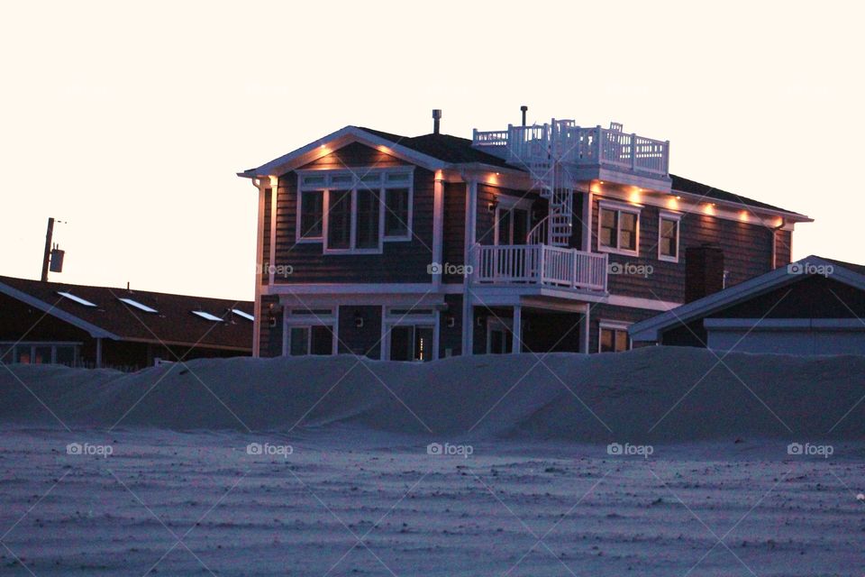 Beach house at dusk. Rebuilding from Sandy