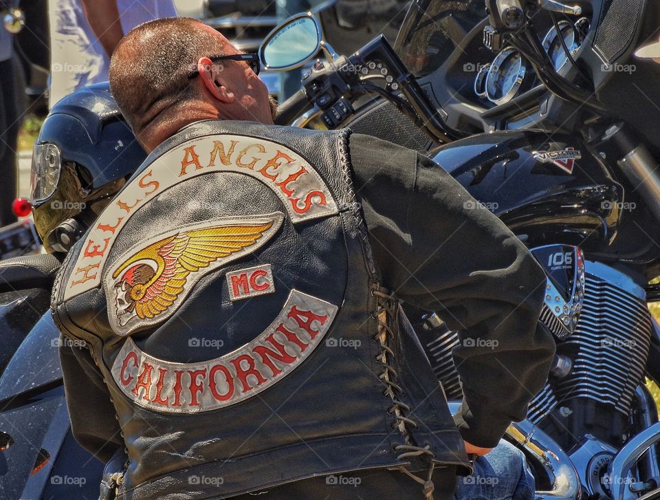 Hells Angels Member. American Biker Wearing Hells Angels Colors And Leather Cut
