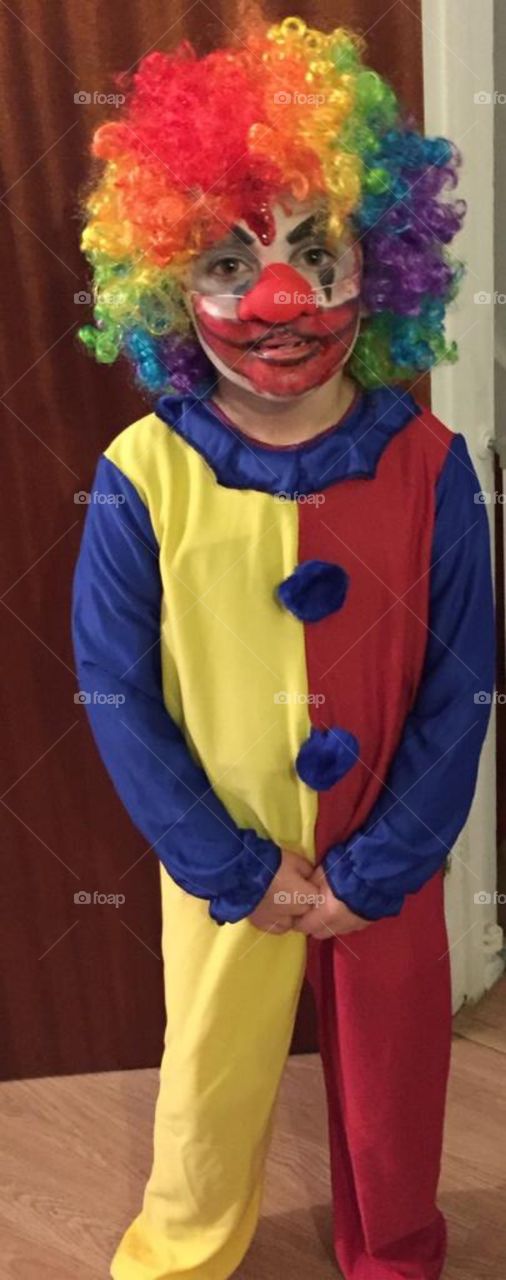 Girl in a Halloween costume as the evil clown 