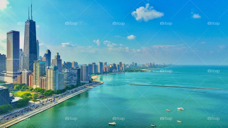 The mesmerizing Lake Michigan as seen from a Birds Eye perspective meets the beautiful Chicago skyline as seen from my drone above the famous Navy Pier.