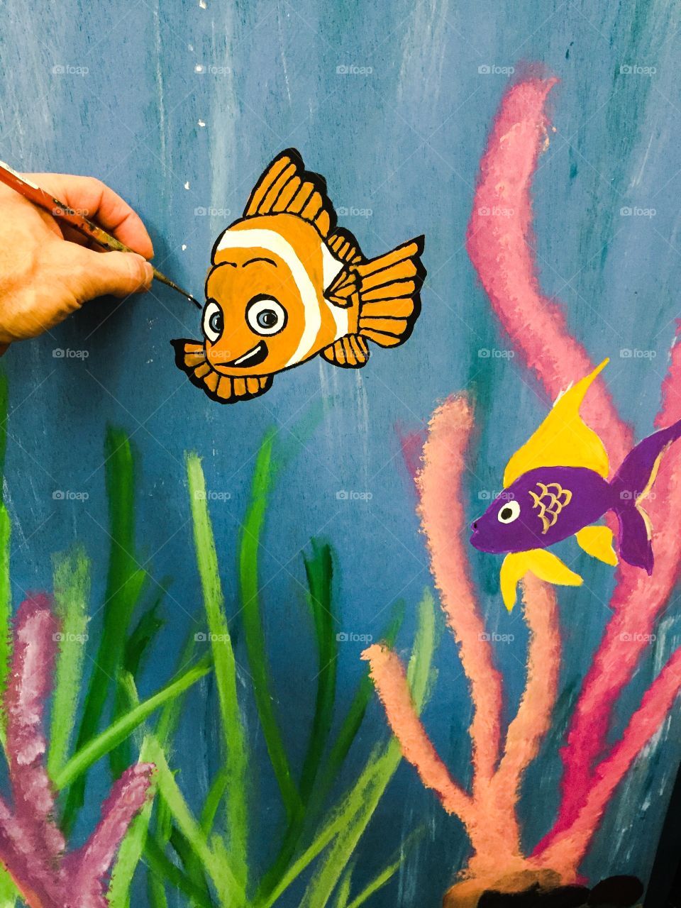 Painting a fish Mural