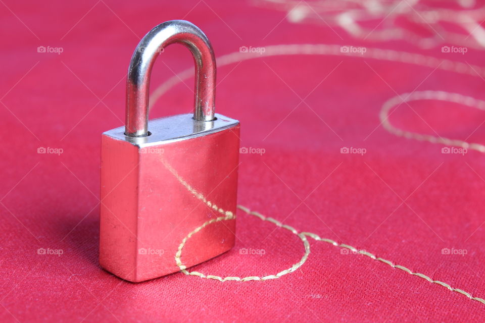 Golden Lock on red background