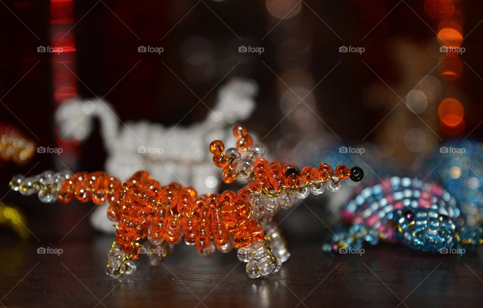 animals figured from beads close up background, art and craft hobbies