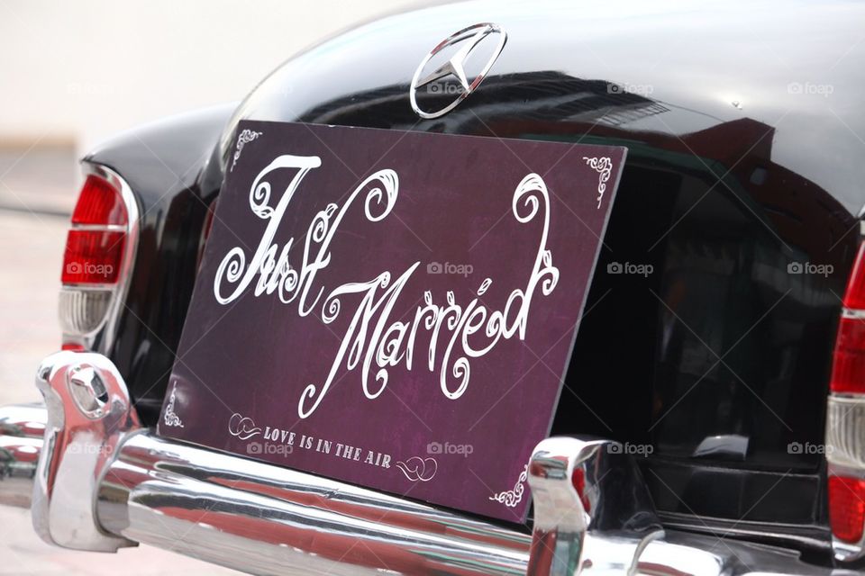 Just married sign on the back of a vintage mercedes benz