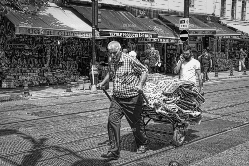 working hard. street photography istanbul Turkey black and white