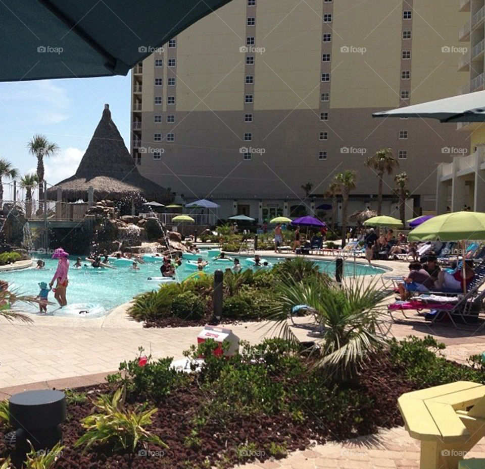 Hotel Pool Deck. Beach umbrellas and a lazy river at a hotel on Pensacola Beach in Florida during the summer of 2013