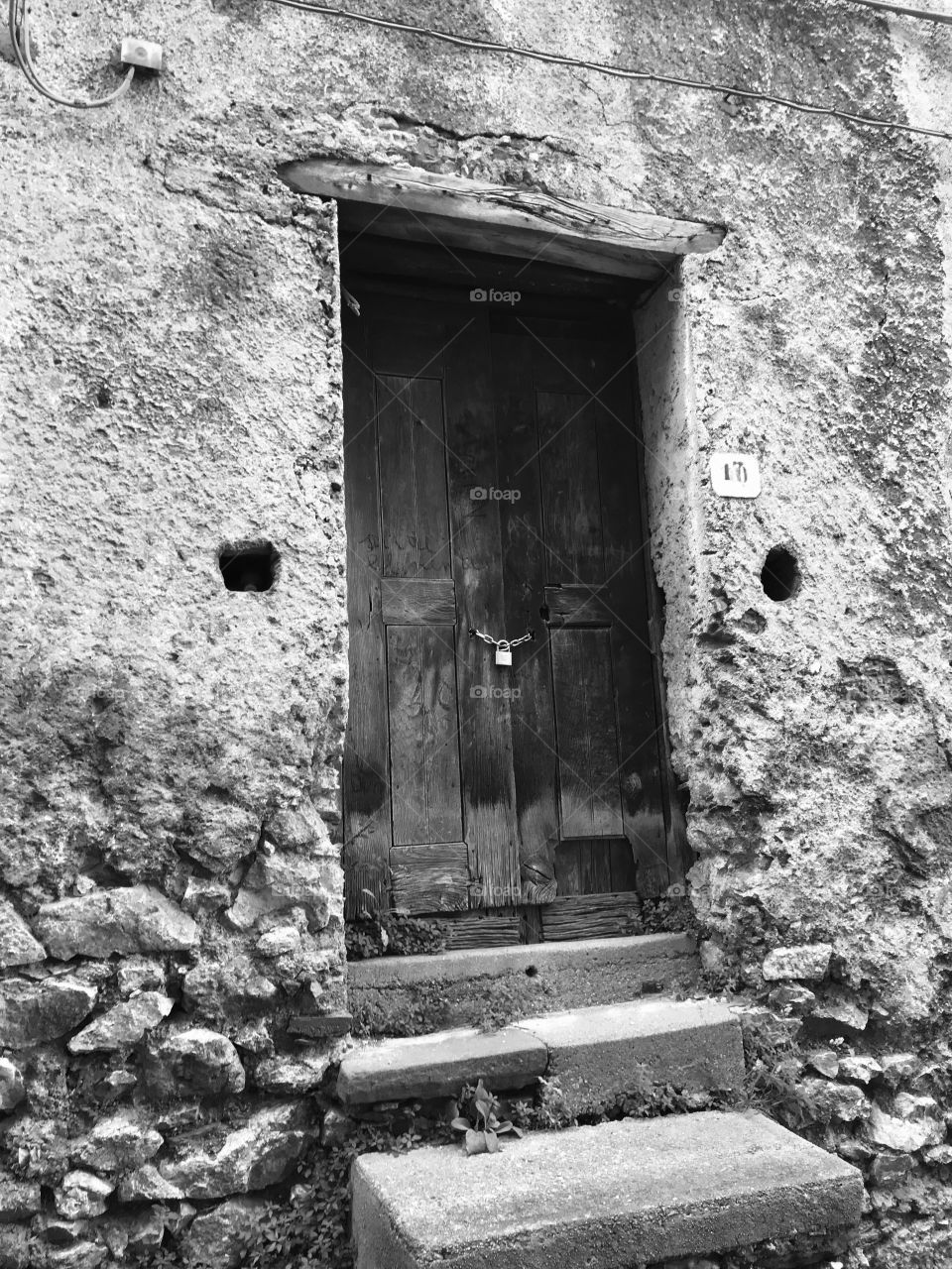 Old door of an abandoned house in Calabria, South Italy 