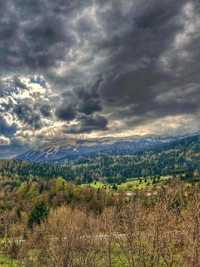 Climbing to the top of the mountain just before the storm