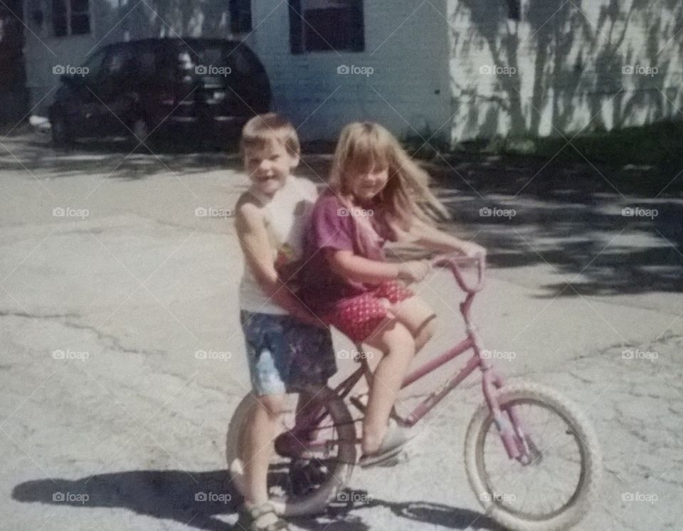 Siblings on Bike