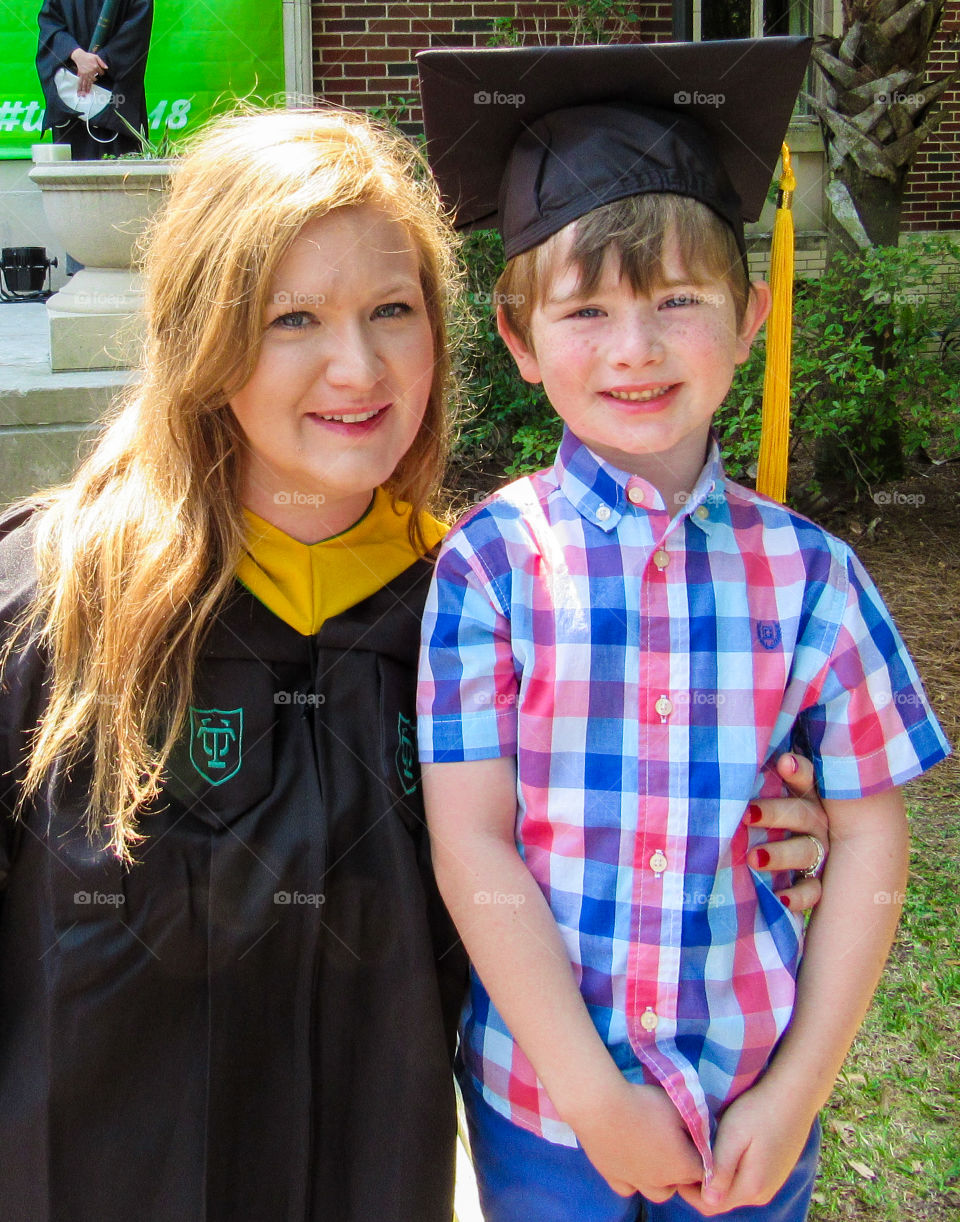 Adult Student with child graduating 