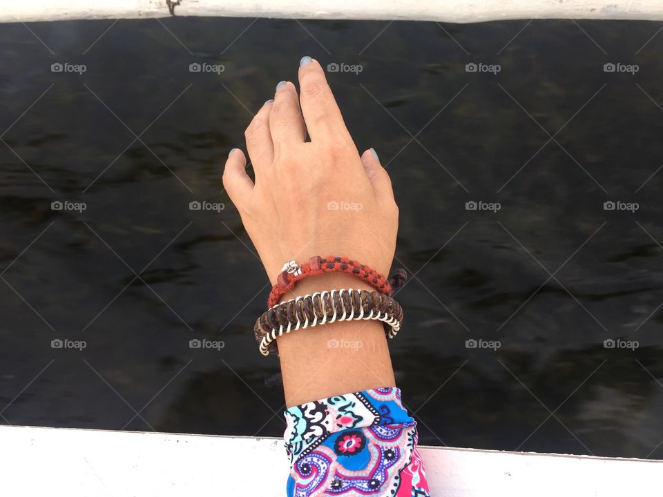 Hand wearing bracelet