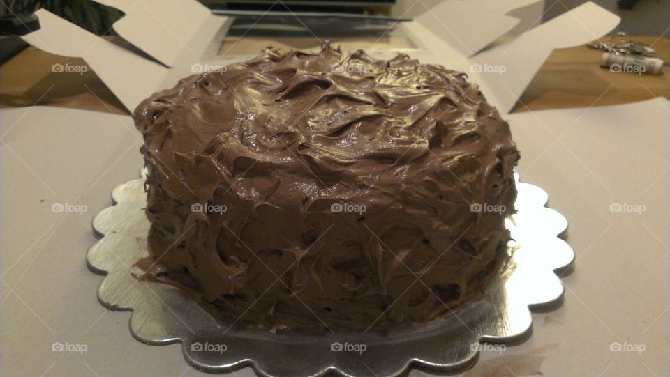 home baked chocolate birthday cake with chocolate icing