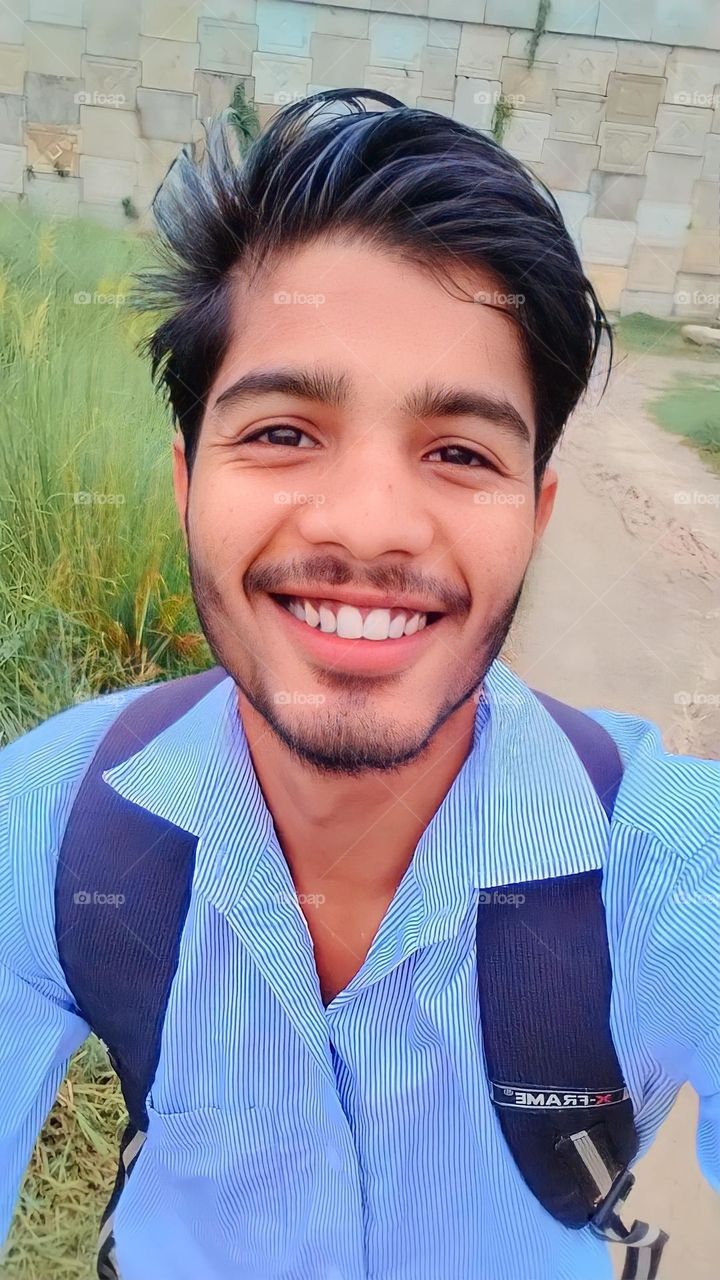 a boy looking camera with happiness face