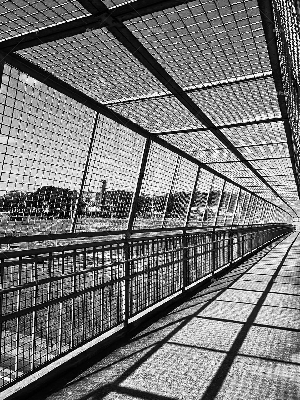 Multiverse B&W: The serene repetition of the security rails of a Catwalk and its shadows