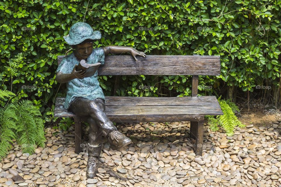 Statue on bench