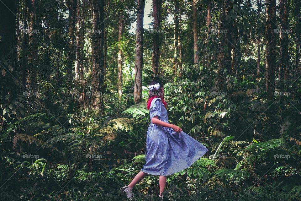 Nature is always amazing, beautiful and bringing refreshment, a young woman enjoying the beautiful forest
